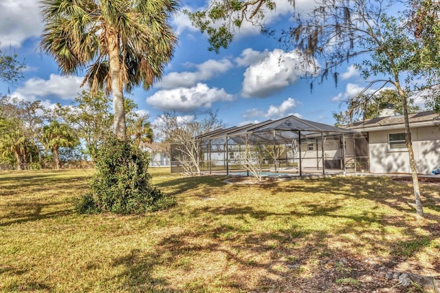 view of yard featuring glass enclosure