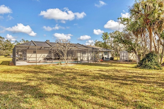 view of yard with a lanai and a storage unit