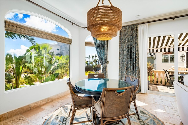 sunroom / solarium with a chandelier