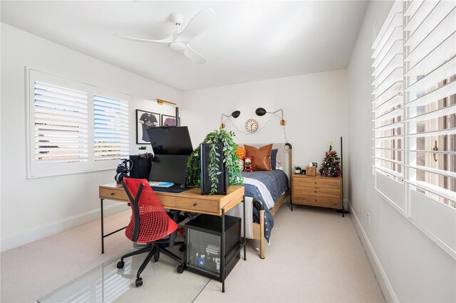 bedroom featuring baseboards, ceiling fan, and light colored carpet