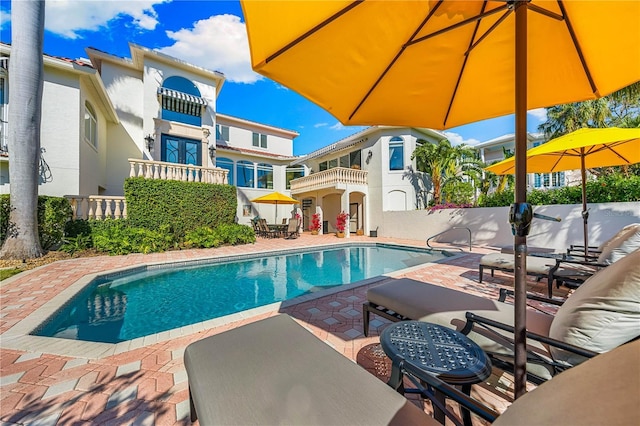 view of pool with a patio, fence, and a fenced in pool