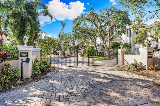 view of gate with fence