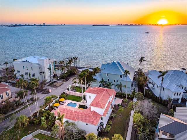 bird's eye view with a water view and a residential view