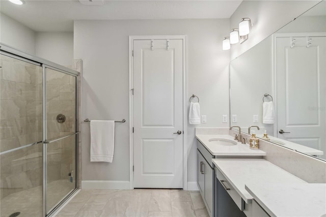 bathroom with walk in shower and vanity