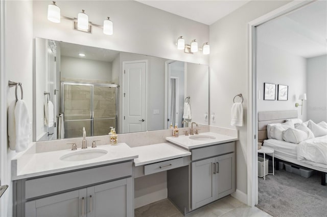 bathroom with vanity and a shower with door