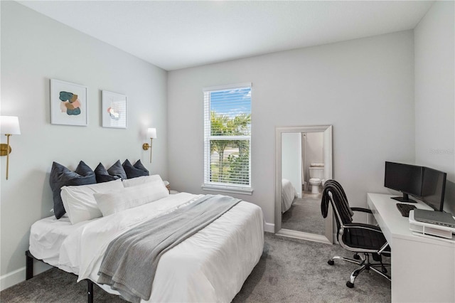 carpeted bedroom with ensuite bath