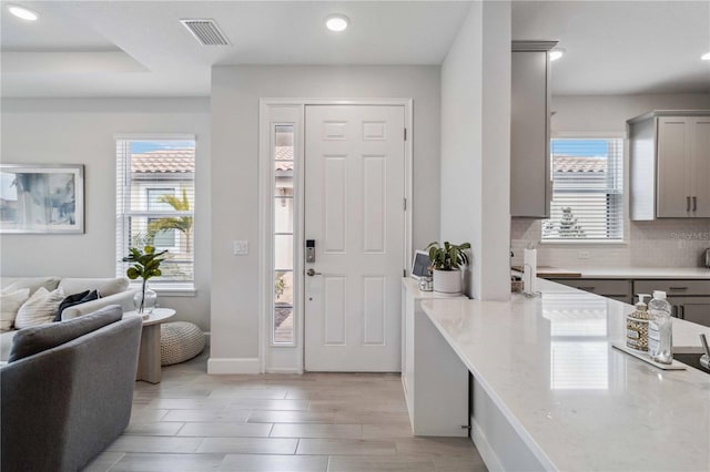 3016 Formia Ct, Bradenton, FL 34211 - foyer with plenty of natural light, recessed lighting, baseboards, and light wood-type flooring