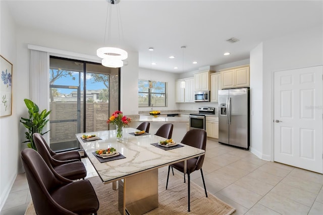 dining area featuring light tile patterned floors