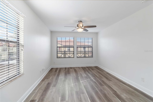 unfurnished room featuring hardwood / wood-style flooring and ceiling fan