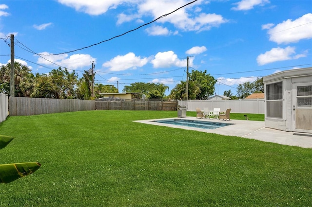 view of yard featuring a fenced in pool and a patio area