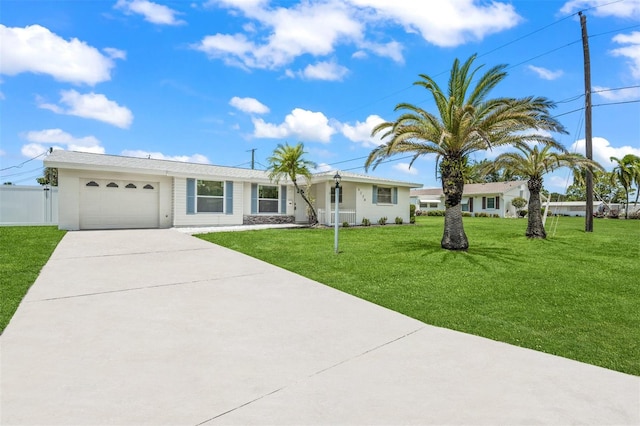 single story home featuring a garage and a front yard