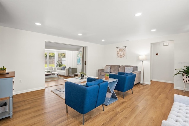 living room with light hardwood / wood-style flooring