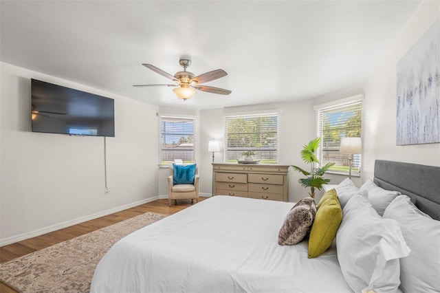 bedroom featuring ceiling fan and light wood-type flooring