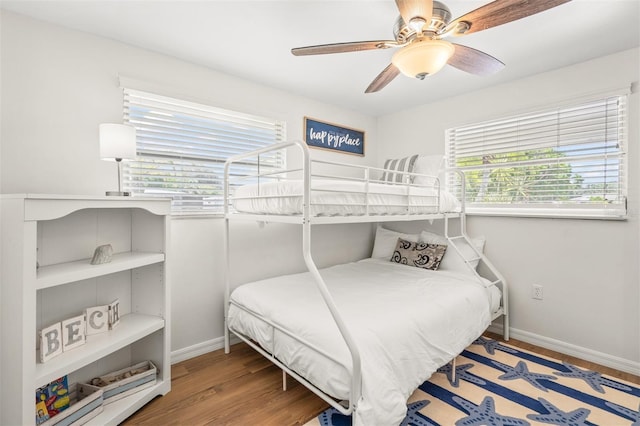 bedroom featuring hardwood / wood-style flooring and ceiling fan