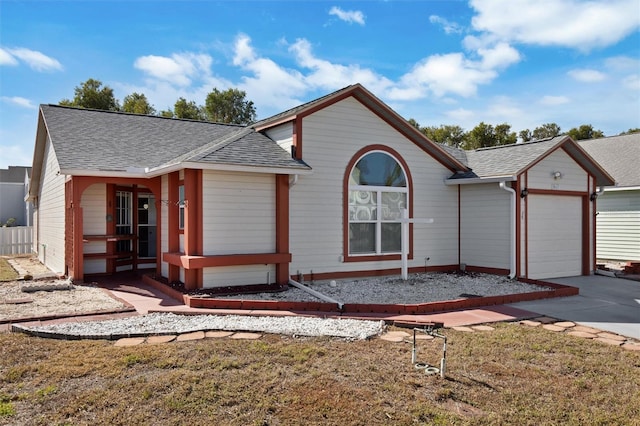 view of front of house with a garage and a front yard