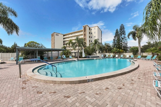 view of swimming pool with a patio