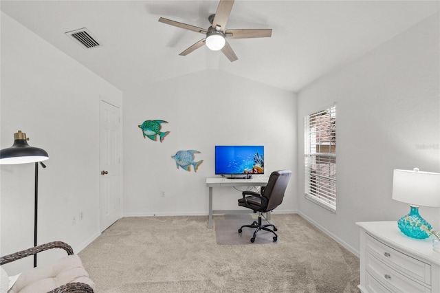 carpeted home office featuring lofted ceiling and ceiling fan