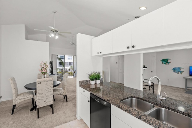 kitchen with dark stone countertops, sink, white cabinetry, and dishwasher