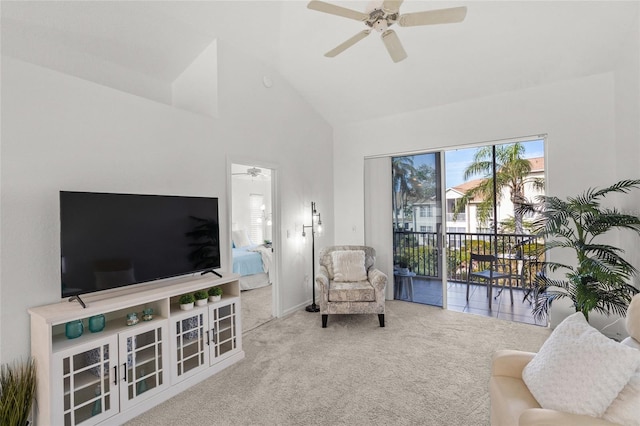 living room featuring high vaulted ceiling, ceiling fan, and carpet