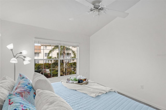 carpeted bedroom with lofted ceiling and ceiling fan