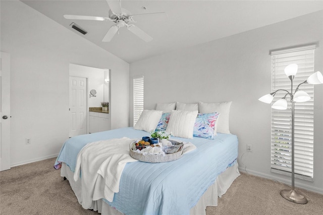 carpeted bedroom with ceiling fan and lofted ceiling