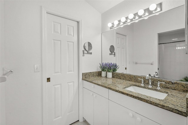 bathroom featuring vanity and walk in shower