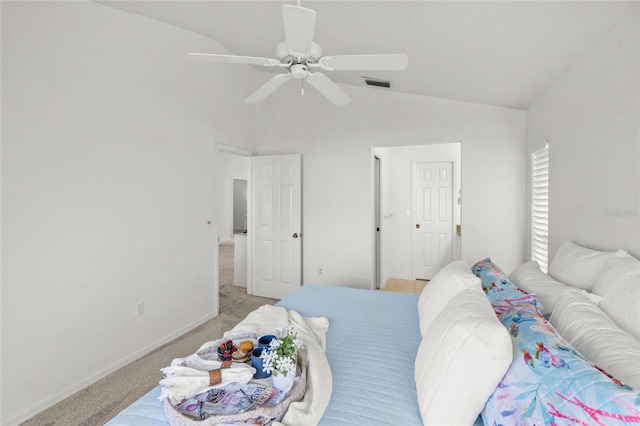 bedroom with ceiling fan, lofted ceiling, and light colored carpet