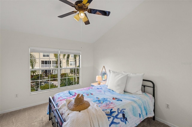 carpeted bedroom with vaulted ceiling and ceiling fan