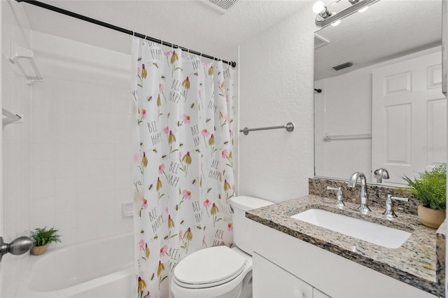 full bathroom with vanity, shower / bath combination with curtain, toilet, and a textured ceiling