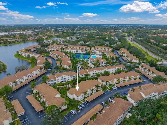 birds eye view of property featuring a water view