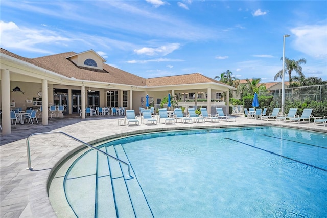 view of swimming pool with a patio