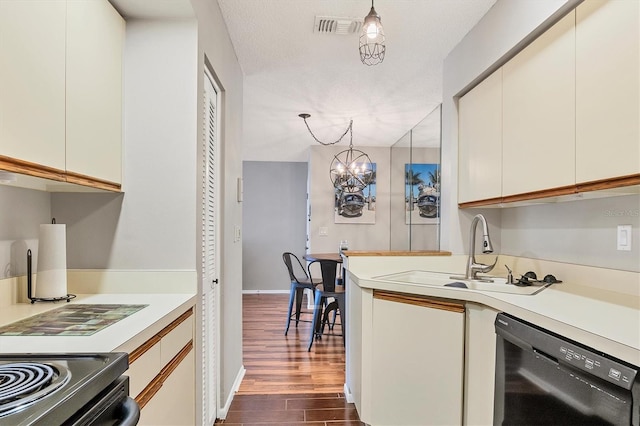 kitchen with dark wood-type flooring, sink, an inviting chandelier, dishwasher, and pendant lighting