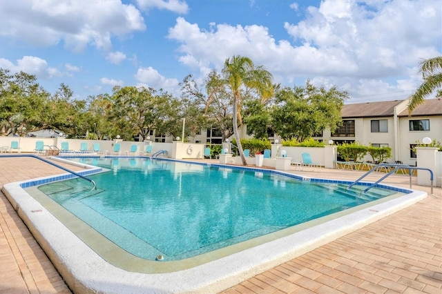 view of swimming pool with a patio area