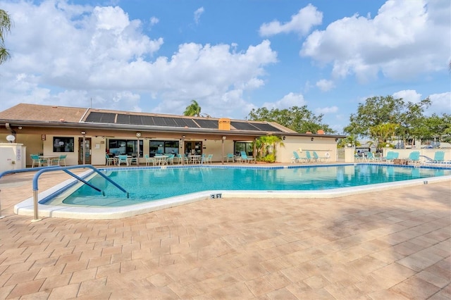 view of swimming pool featuring a patio area