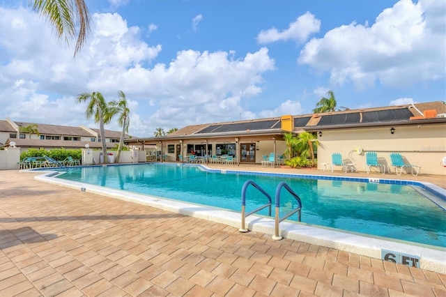 view of swimming pool with a patio