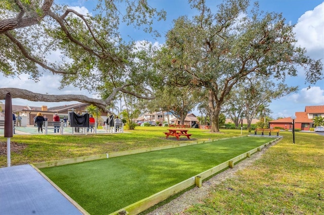 view of home's community featuring a yard