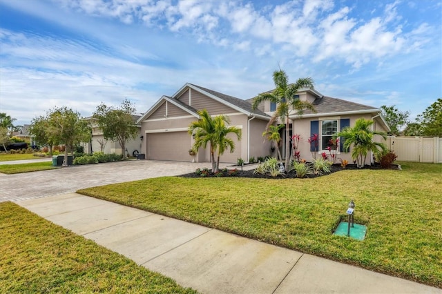 single story home featuring a garage and a front yard