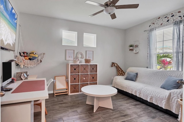 interior space featuring dark wood-type flooring and ceiling fan