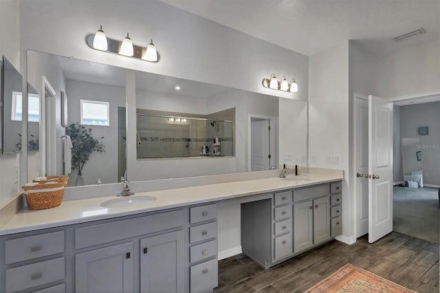 bathroom with vanity and an enclosed shower