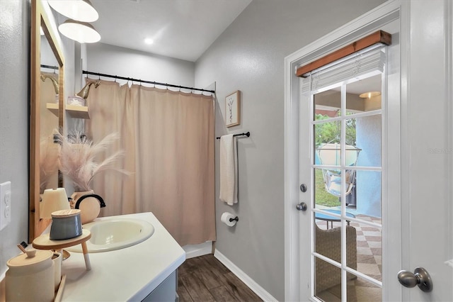 bathroom featuring vanity, hardwood / wood-style floors, and a shower with shower curtain