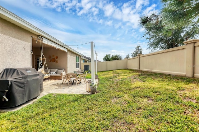 view of yard featuring a patio and central AC