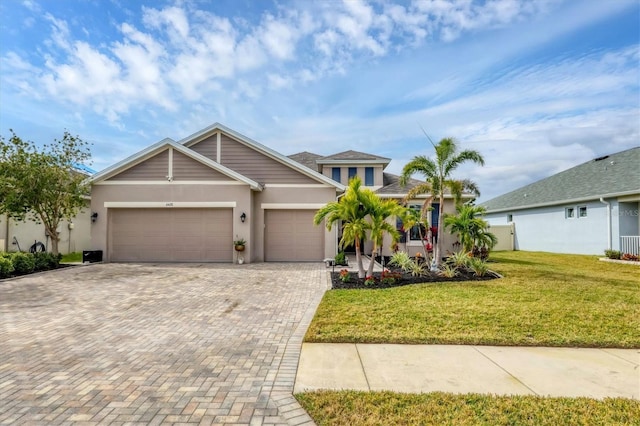 view of front of property with a garage and a front yard