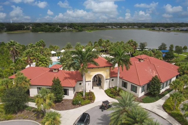 birds eye view of property with a water view