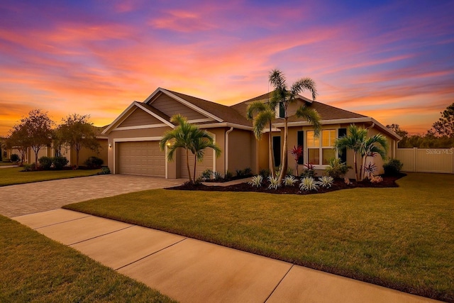 6428 Devesta Loop, Palmetto, FL 34221 - ranch-style house featuring driveway, an attached garage, and stucco siding