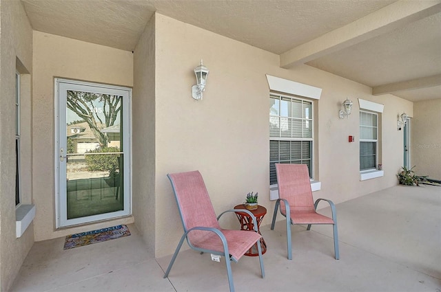 entrance to property with a patio