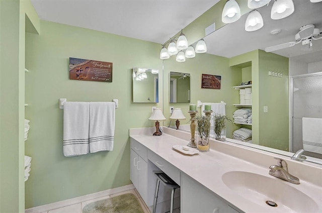 bathroom with tile patterned flooring, vanity, and an enclosed shower