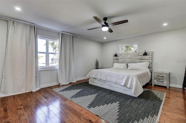 bedroom with hardwood / wood-style flooring and ceiling fan