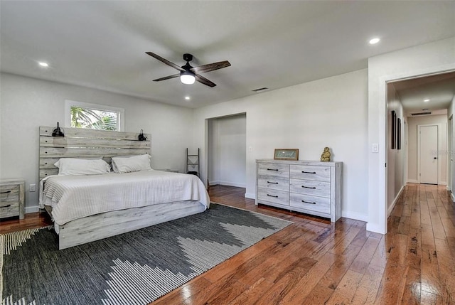 bedroom featuring dark wood-type flooring and ceiling fan