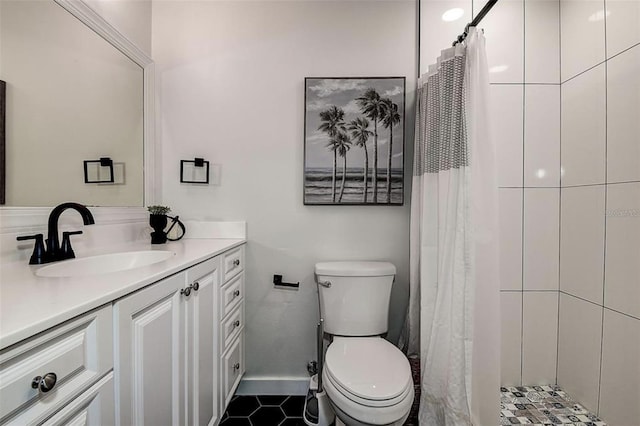 bathroom with tile patterned flooring, vanity, a shower with shower curtain, and toilet