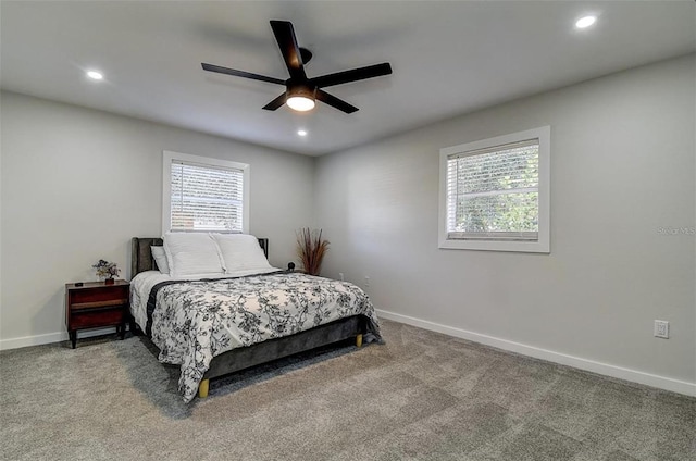 carpeted bedroom with ceiling fan